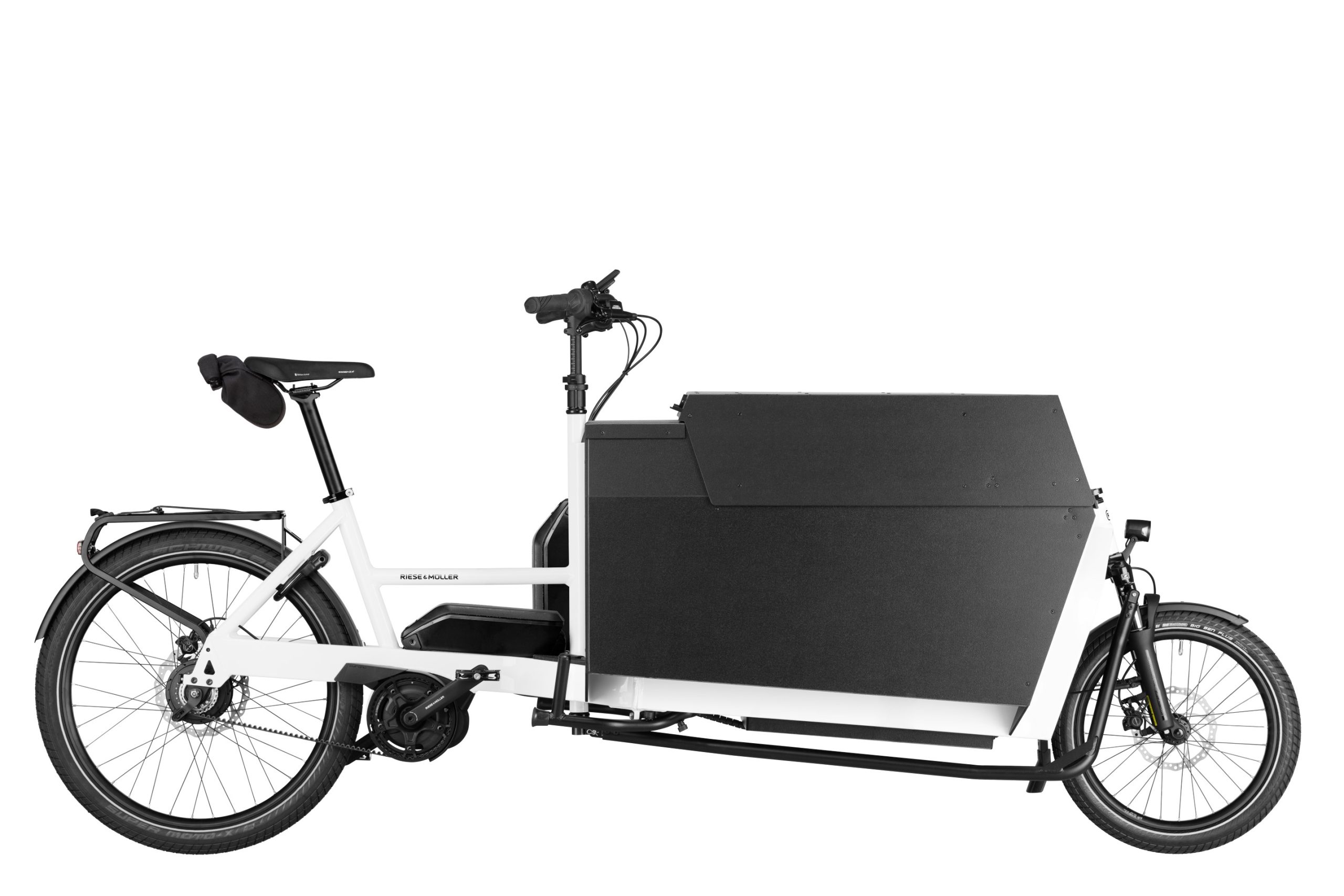 A white Riese and Muller Transporter2 85 Vario cargo bike with flat covered box