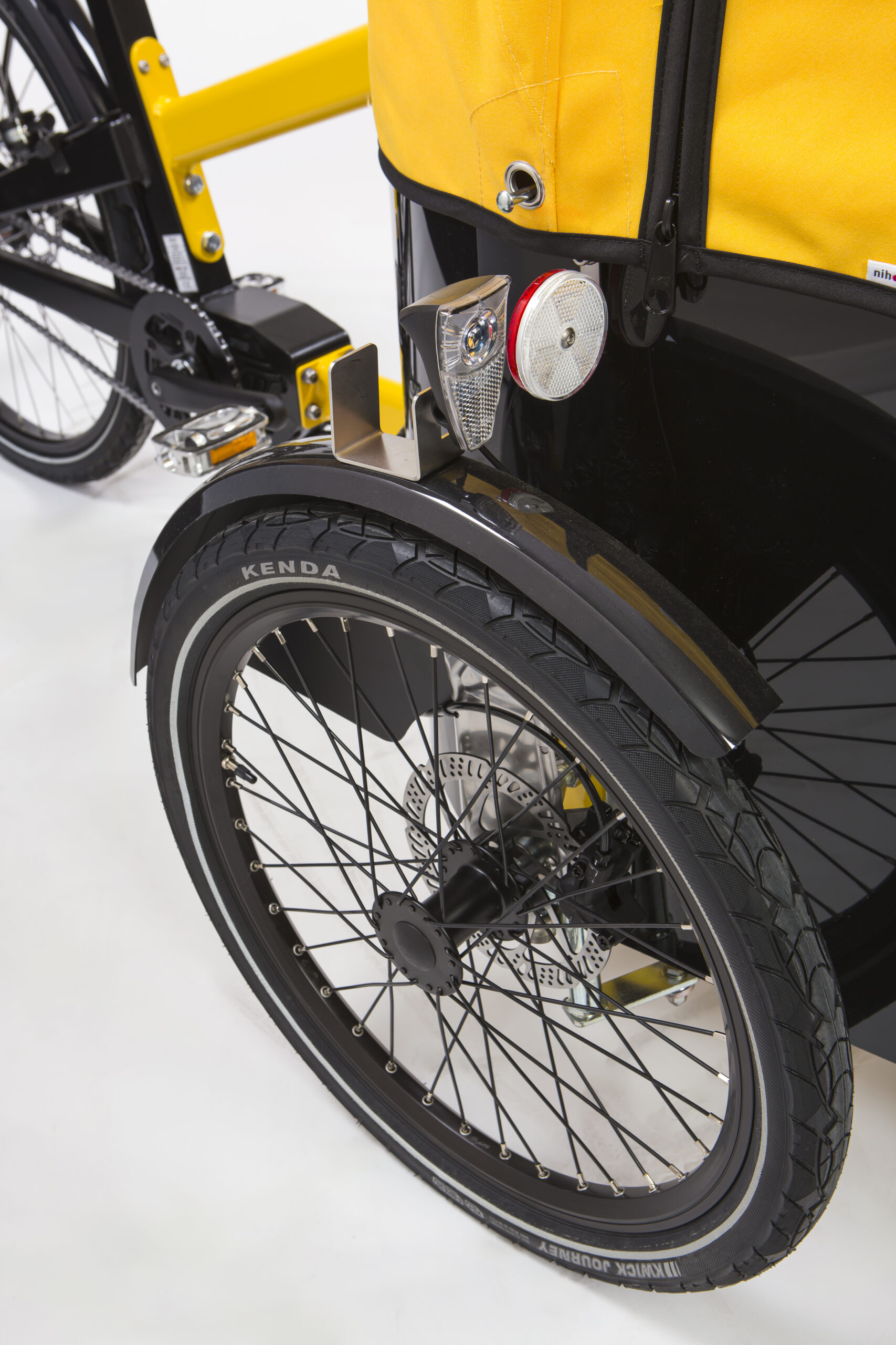 Close up of the front wheel of a Nihola Family Gen 2 cargo bike