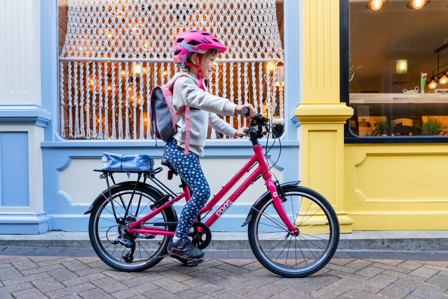 Child on a pink Frog City 53 bike